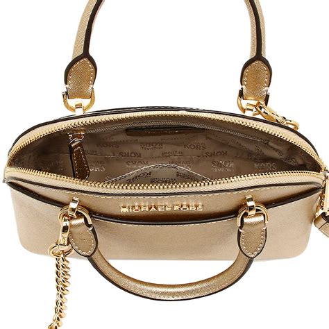 michael kors satchel handbag with gold trimming|Michael Kors opened satchel purse.